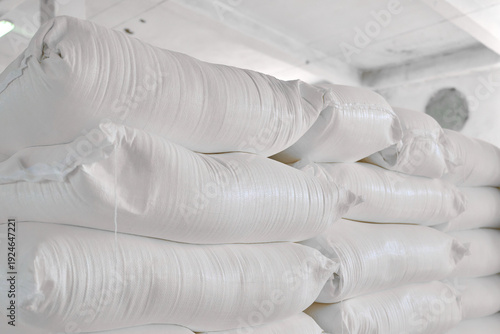 Warehouse storing sacks of wheat flour arranged neatly on shelves