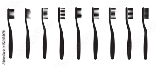 Modern Black Toothbrushes Arranged in a Row for Essential Dental Care and Oral Health on White.