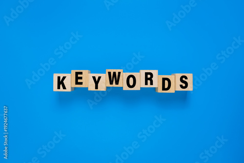 Tableau sur toile keywords word on wooden blocks. isolated on blue background