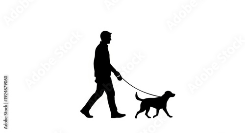 Silhouette of a man walking his dog on a leash
