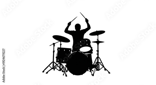 Silhouette of a drummer playing a drum set