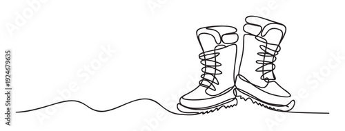 Simple continuous line drawing of two winter boots with laces and rugged soles, perfect for various graphic resources, print material, posters, web graphics, or decorative elements.