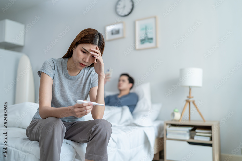 Obraz premium Asian young woman feel shock after look at positive pregnancy test. 