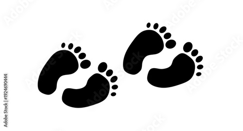 Black baby footprints walking diagonally across white background in simple minimalist design