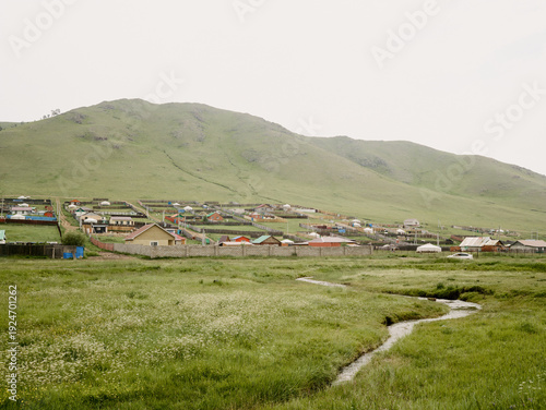 Peaceful Rural Landscape with Green Hills and Meadow Stream