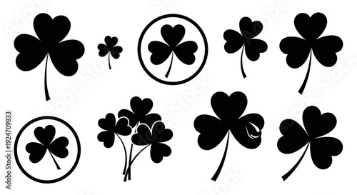 Collection of black shamrocks and clovers with varied shapes and sizes