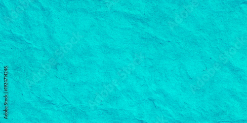 Cyan blue crumpled paper texture background with wrinkled parchment effect shows intricate folds, creases, and shadows effect suitable for vibrant graphic design.