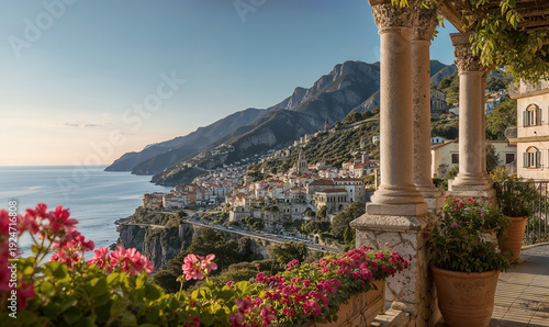 Beautiful Mediterranean coastal town on Amalfi Coast with ancient stone pillars and colorful flowers in sunny Italy