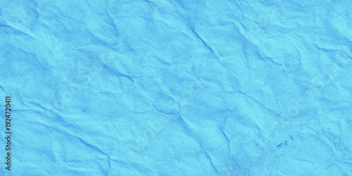 Cyan blue crumpled paper texture background with wrinkled parchment effect shows intricate folds, creases, and shadows effect suitable for vibrant graphic design.