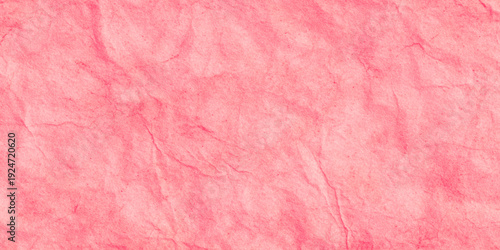 Pink crumpled paper texture background with wrinkled parchment effect shows intricate folds, creases, and shadows effect suitable for vibrant graphic design.