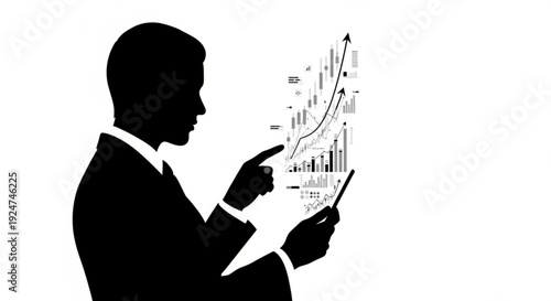 Businessman in silhouette analyzing data on a tablet with graphs