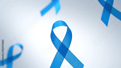 Blue awareness ribbons floating and rotating against a light background, symbolizing prostate cancer awareness and men's health support