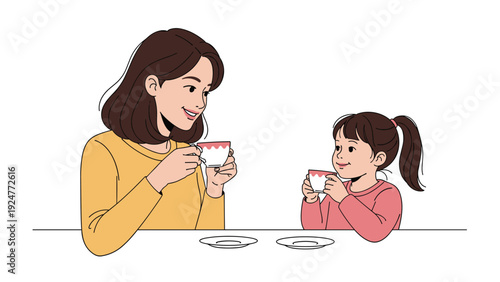 Young mother and her little daughter enjoy a quiet moment together while sitting at a table and drinking tea from cups.