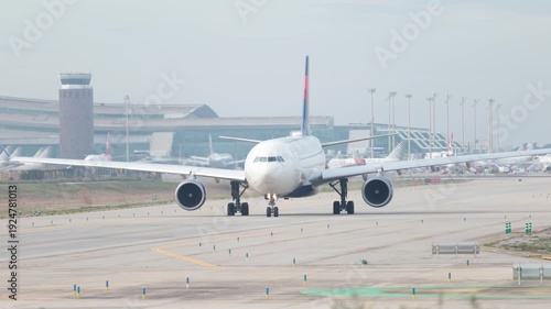  Airplane is preparing for takeoff on the runway in an airport of Barcelona. High quality 4k footage