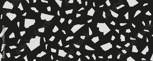 Seamless black and white torn paper pattern with irregular abstract shapes scattered randomly on dark background. Abstract collage texture scrap fragment paper.