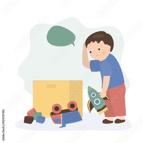 Unhappy cute child do not picking toys into box. Tired little kid boy playing with toys. Household, small kid helper with various items.