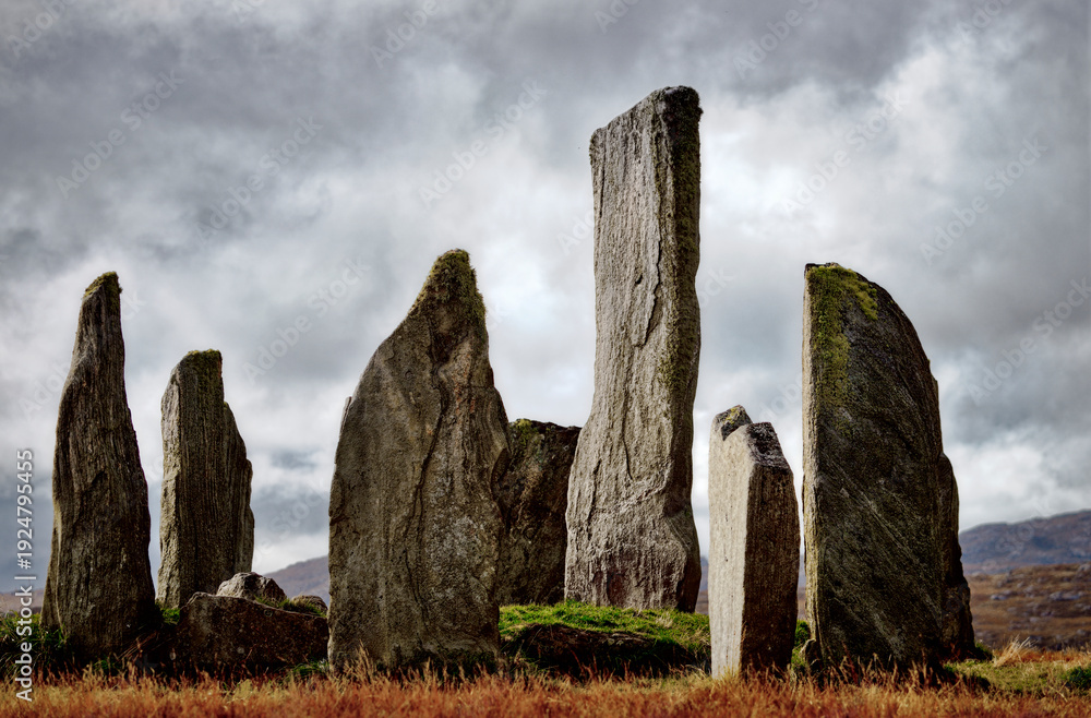 Fototapeta premium Tursachan prehistoric Neolithic stones at Callanish, Isle of Lewis, Scotland. aka Callanish I. The tall central monolith and part of the core circle