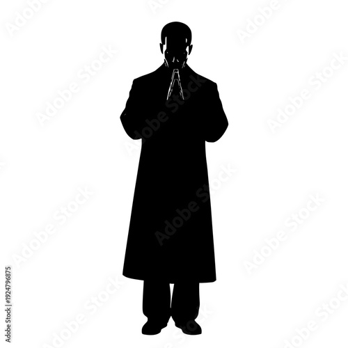 Mysterious figure in a long coat holding a small object against a stark background