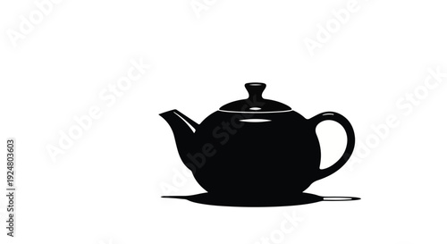 Classic black teapot with saucer on a white background