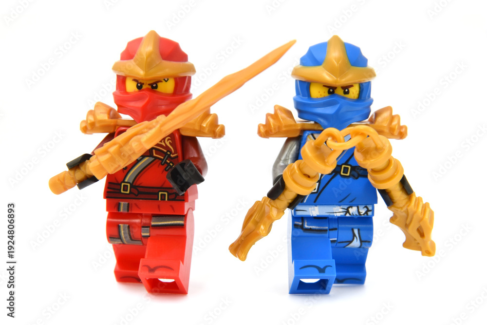 Fototapeta premium Editorial illustrative image of meeting of two lego ninjago minifigures fire ninja Kai and Jay isolated on white. Popular lego theme to 15 Years edition.