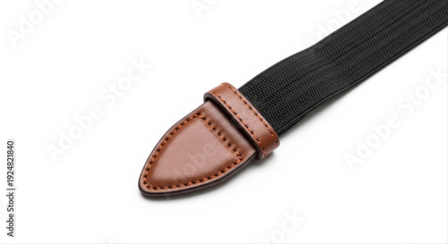 Black elastic belt with brown leather tip isolated on a pristine white background, showcasing detailed stitching and sleek design