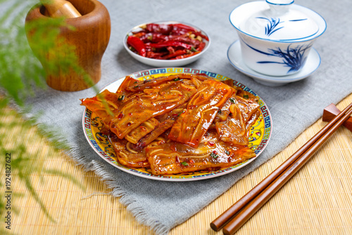 Fotografie Glazed Pig Ear with Asian Condiments and Tea Service