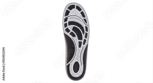 Ergonomic insole pad with detailed tread design isolated on white background, showcasing modern comfort technology and foot support features