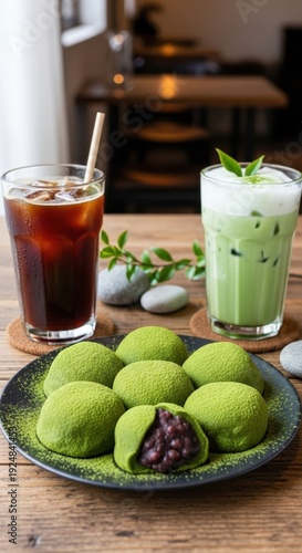 Matcha mochi and iced drinks on a wooden table.