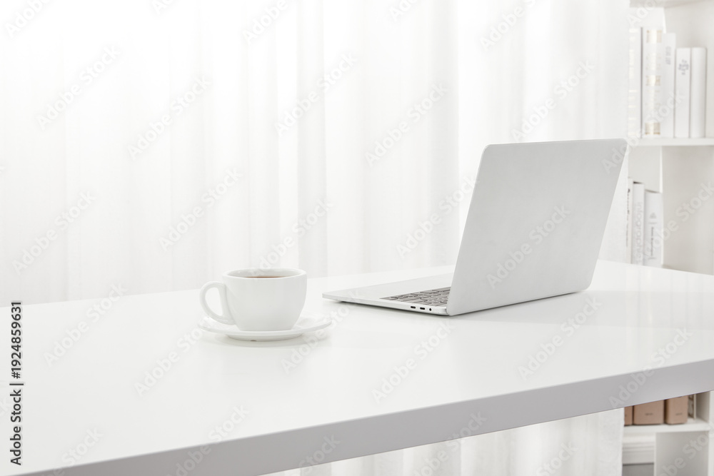 Fototapeta premium Elegant Office Workspace with Coffee and Laptop