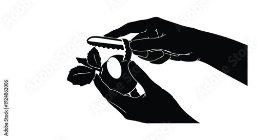 Hands carefully peeling a fresh strawberry with a small peeler