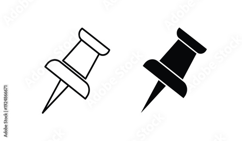 Two push pins in black and white on a pure