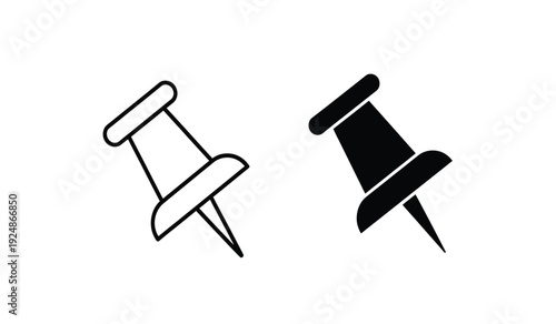 Two push pins in black and white on a clean and simple background for office or design use