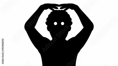 Person forming heart shape with hands on head