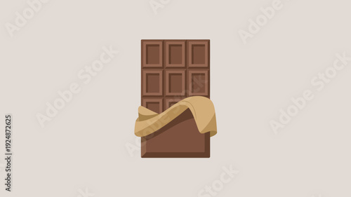 A delicious chocolate bar with golden wrapping on a beige background