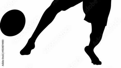 Silhouette of rugby player kicking ball in action