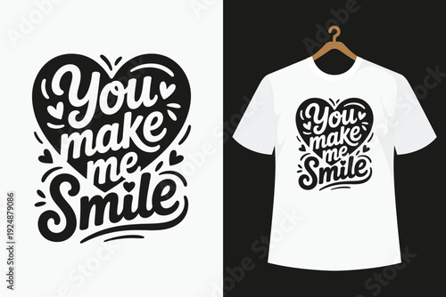 White t-shirt with black heart and text you make me smile on hanger