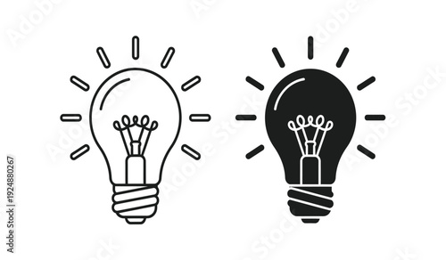 Black and white light bulb icons with rays on for ideas and inspiration