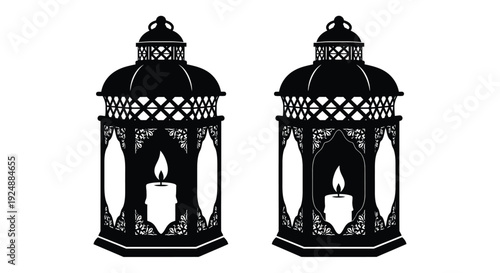 Two ornate black lanterns with lit candles a symmetrical design