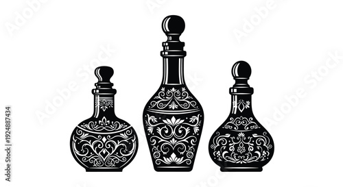 Vintage perfume bottles in black and white ornate decorative design