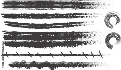 Collection of black ink brush strokes and scribbles on white background