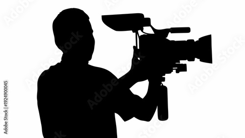Silhouette of videographer holding professional camera equipment