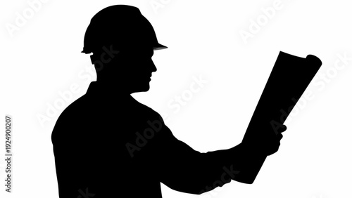 Construction worker reviewing plans on site with hard hat