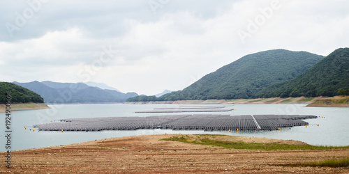 Floating solar power plant on reservoir surrounded by mountains