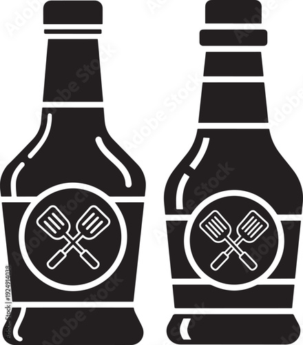 Two black and white vector graphics of condiment bottles, one with a smooth cap and the other with a ribbed cap, both featuring crossed spatulas on their labels.