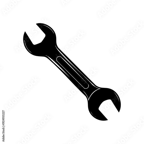 A black double-ended wrench lies diagonally on a neutral background, viewed directly from above.