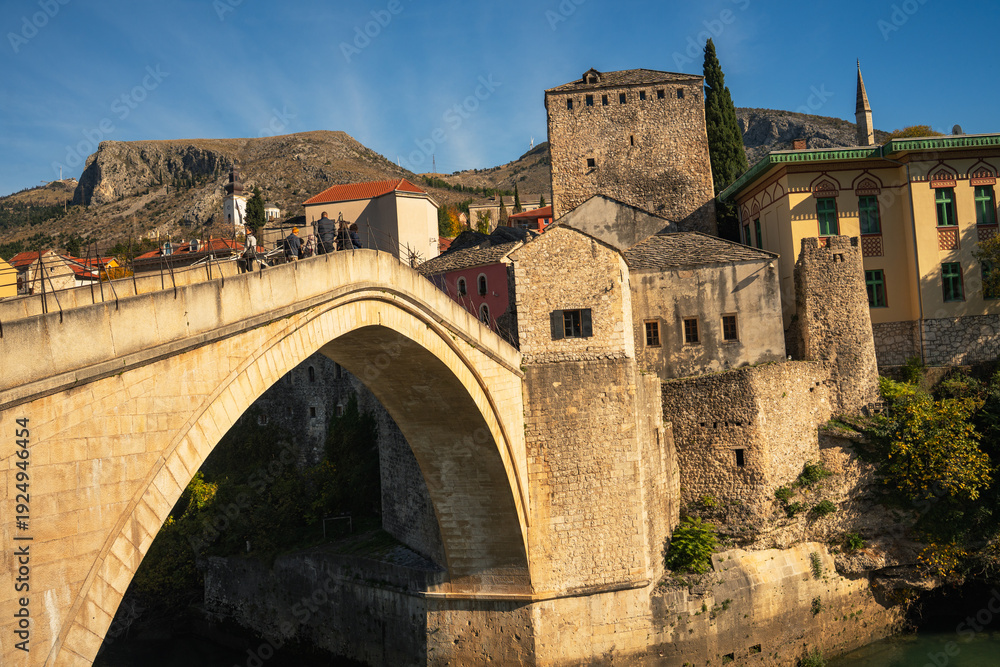 Obraz premium Historic Stari Most Old Bridge in Mostar over Neretva river, UNESCO World Heritage site in Bosnia and Herzegovina, Ottoman stone architecture