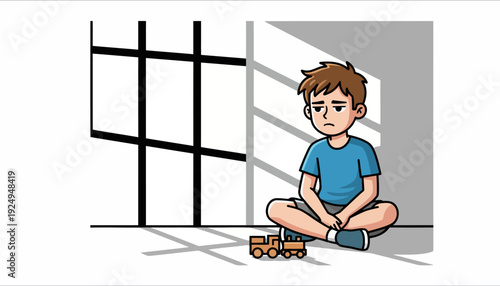 Sad lonely boy sitting on floor with toy train.
