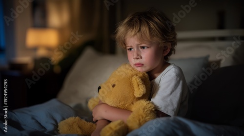 Wallpaper Mural Tender moment of a young child experiencing discomfort, portraying raw emotions and the innocence of childhood struggles, perfect for health awareness campaigns. A dimly lit room with soft shadows, Torontodigital.ca