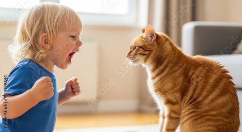 Fierce face-off: toddler confronts ginger tabby cat in playful indoor scenario