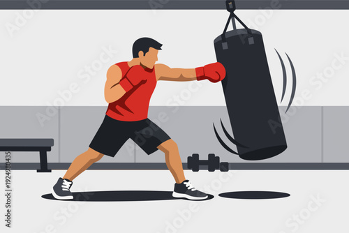 Man training boxing in gym punching a heavy bag for fitness and workout